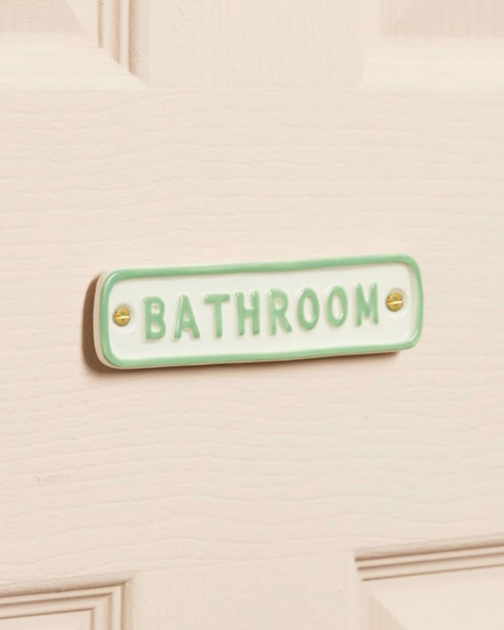 Señal de baño de cerámica